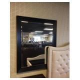 Black framed hanging mirror