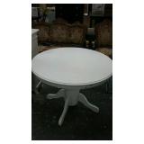 White round wood dining table