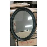 Oval black accent mirror