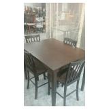 Dark brown dining table and 4 chairs