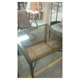 Glass top metal patio table