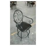 Dark brown leather and metal arm chair, swivels