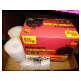 Partial boxes of garbage bags