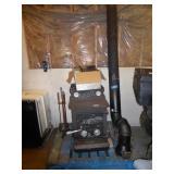 Wood stove  w/ chimney pipe & tools - 21" wide