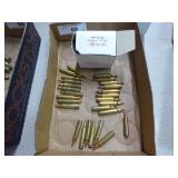 Twenty-seven 204 Ruger ammo & some empty brass