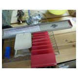 Paper cutters & wire basket of items Paper cutters & wire basket of items