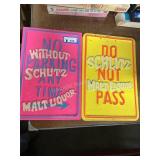 Two Schlitz advertising signs