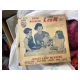 Box with yarn, hand weaving loom, blanket and