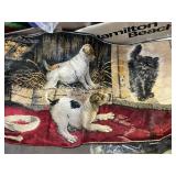 Box of towels, blankets all dog rug, and wolf