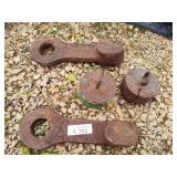 2 weights and 2 heavy iron parts