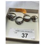 Four sterling rings - approximately 27.4 grams