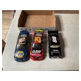 3 Die cast racing cars
