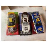 3 Die cast racing cars