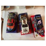 3 Die cast racing cars