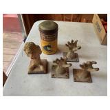 Metal hands, can and statue