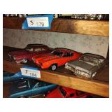 3 die cast cars