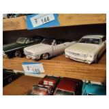 3 die cast cars