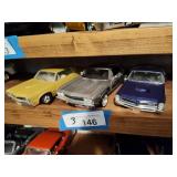 3 die cast cars