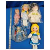 4 dolls and purse