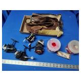 4 fishing reels, bobbers, rapala, case and sling