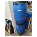 2 empty plastic barrels