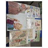 Assortment of paper dolls