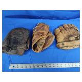 3 baseball mitts