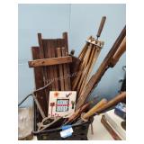 Crate of sprinklers, wood stands and other