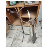 2 plant stands and shovel