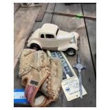 4 items: Ball glove, letter opener, car and
