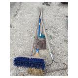 Brooms and rake