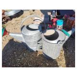 2 galvanized watering cans
