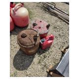 2 metal gas cans and 1 plastic gas jug