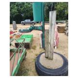 Cattle scratcher with concrete base