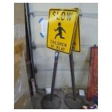 2 Slow signs w/ stands (stands are cast base)