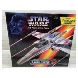 Electronic X wing fighter marked 1995