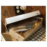 Box of gold color flatware