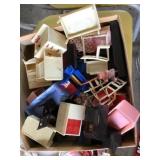 Box of plastic doll house furniture