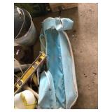 Blue golf bag and some clubs