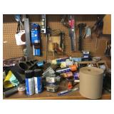 Tools and misc. on wall and top and inside cabinet