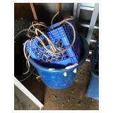 Blue bucker and crate of rope