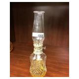Small clear glass oil lamp