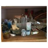 Vases/ light bulbs and serving trays on shelf in