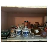 Tea mugs/ iron and glassware on shelf in closet
