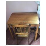 Oak lift top desk with cane bottom chair
