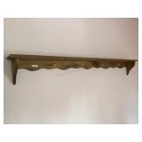 Long wood shelf with coat pegs