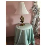 Brass table lamp and round wood decorator table
