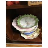 Stack of various old plates and bowls