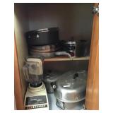Blender/ Pots and pans/ Roaster pan in cabinet