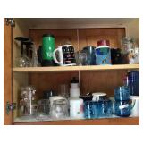Blue glasses/coffee mugs and glassware in cabinet